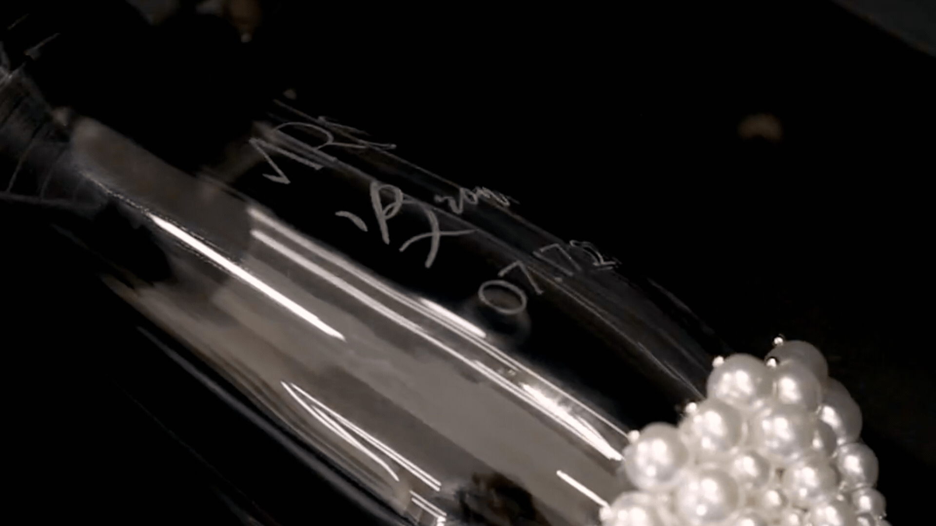 Laser engraving process on a personalized wedding champagne flute by Elena Honch