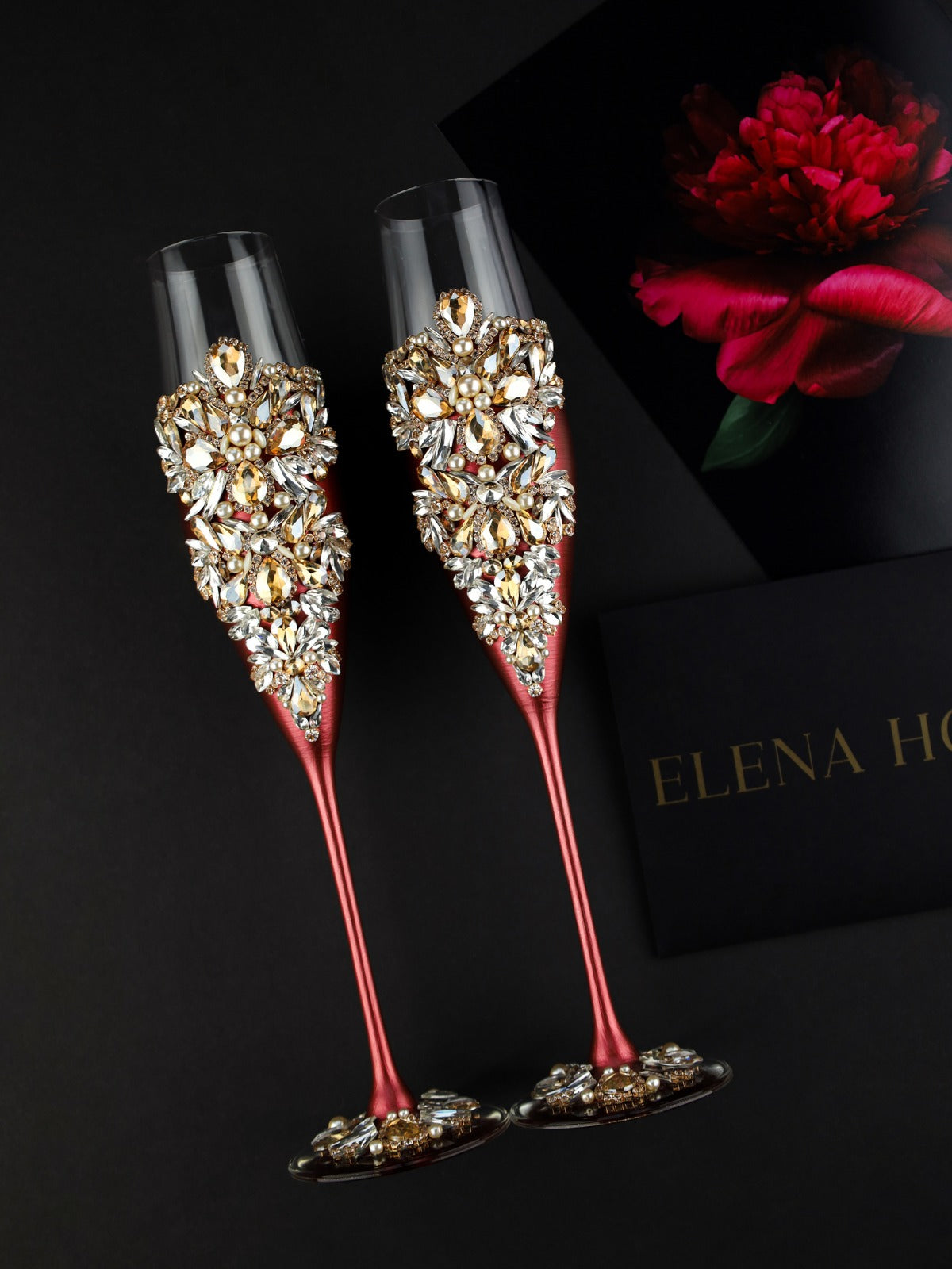 Burgundy champagne flutes and pillow for rings